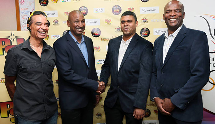 President of the TT Cycling Federation Robert Farrier, second from left, shakes hands with Mukesh Ramsingh of Metro Hotel, while PSL CEO Desmond Roberts, right, and cycling icon Gene Samuels, left, looks on at the PSL Fire on Wheels launch at TTOC headquarters, Abercromby Street, Port of Spain, yesterday. All smiles is from left while TTCF president Robert Farrier.