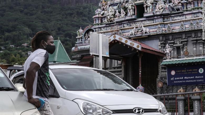 A man outside Arul Mihu Navasakthi Vinayagar Temple in Seychelles' capital Victoria on April 3, 2021.