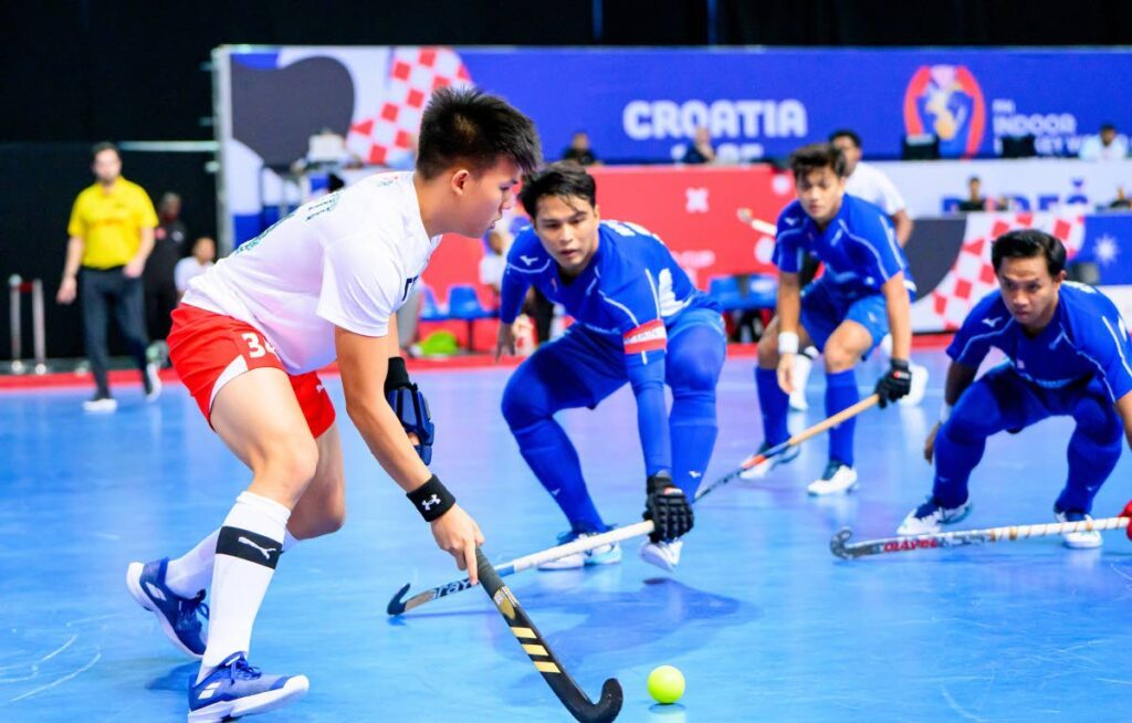 TT men's hockey player Nicholas Siu Butt is closed down by three Malaysian players during the 11th-place playoff at the FIH Indoor World Cup at th Zatika Sport Centre, Porec, Croatia on February 9. - Photo courtesy FIH (Image obtained at newsday.co.tt)